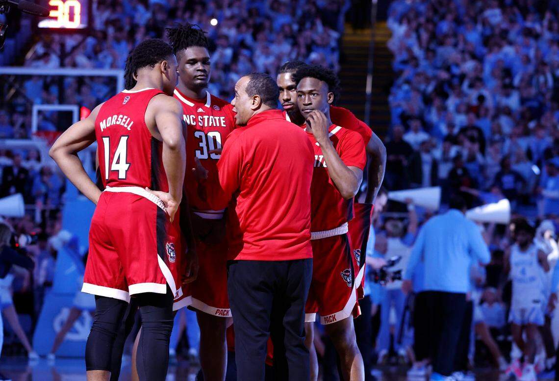 N.C. State head coach Kevin Keatts talks with his team before the Wolfpack’s game against UNC at the Smith Center in Chapel Hill, N.C., Saturday, Jan. 21, 2023.