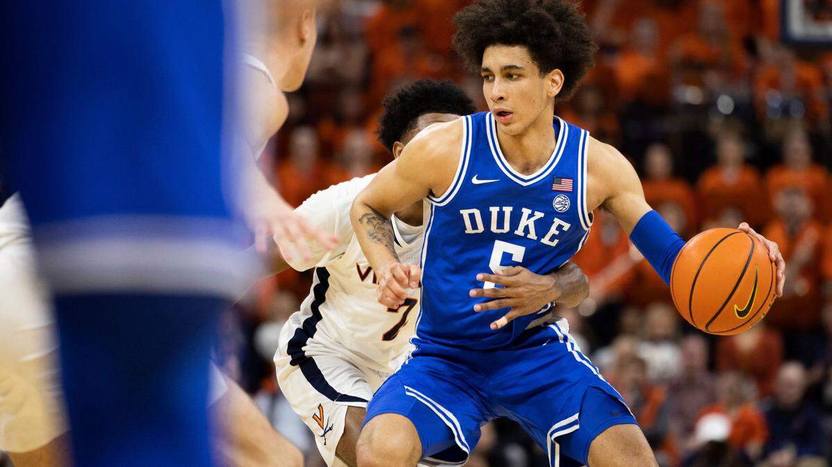 Duke’s Tyrese Proctor (5) defends the ball against Virginia during the first half of an NCAA college basketball game in Charlottesville, Va., Saturday, Feb. 11, 2023. (AP Photo/Mike Kropf)
