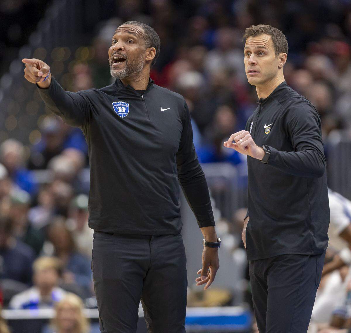 Duke coach Jon Scheyer, and assistant coach Chris Carrawell  direct their team on offense in the first half against St. John’s during the Sweet Sixteen of the NCAA Tournament on Friday, March 27, 2026, at Capital One Arena in Washington, D.C.