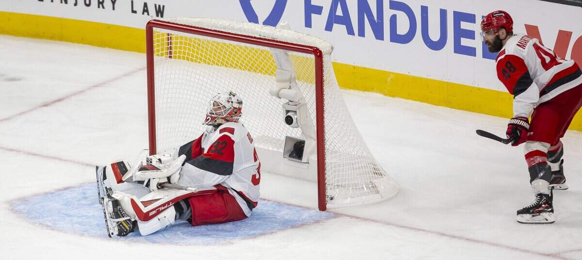 Carolina Hurricanes goalie Brandon Bussi (32) and left wing Jordan Martinook (48) react after a 5-4 double overtime loss to Vegas in Game 3 of the Stanley Cup Final, on Saturday, June 6, 2026 at T-Mobile Arena in Las Vegas, NV.