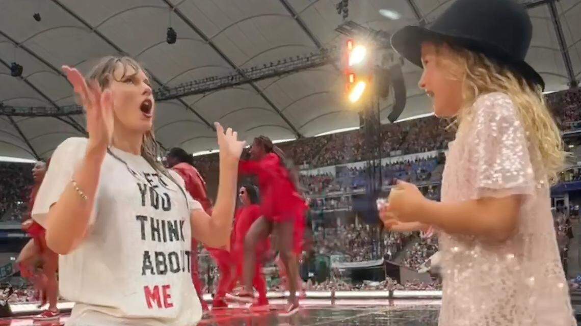 A screenshot shows Taylor Swift and Lucia Nova Hugelmeyer after Swift gave the Chapel Hill girl her 22 hat at a concert in Hamburg, Germany.