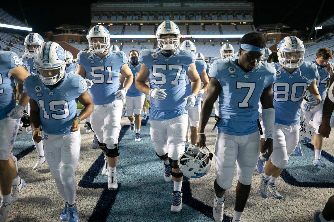 North Carolina linebacker Eugene Asante (7) and his teammates leave the field following their 31-17 loss to Notre Dame on Friday, November 27, 2020 at Kenan Stadium in Chapel Hill, N.C.