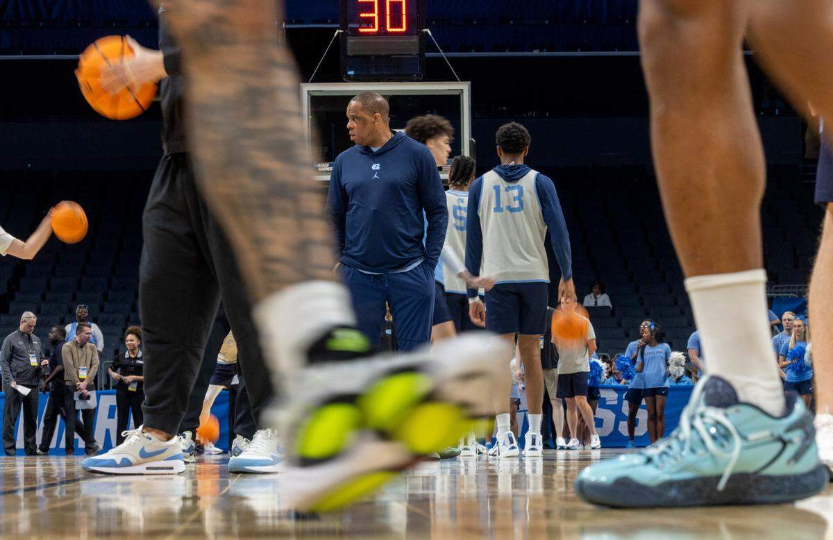 North Carolina coach Hubert Davis stands at mid-court as his players run through their workout on Wednesday, March 20, 2024 as they prepare for the NCAA Tournament at Spectrum Center in Charlotte, N.C.