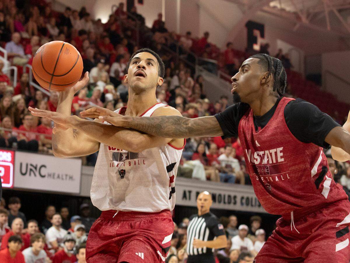 N.C. State’s Ismael Diouf is fouled by teammate Dontrez Styles during a scrimmage at the Primetime with the Pack preseason event on Friday, Oct. 25, 2024, at Reynolds Coliseum in Raleigh, N.C.