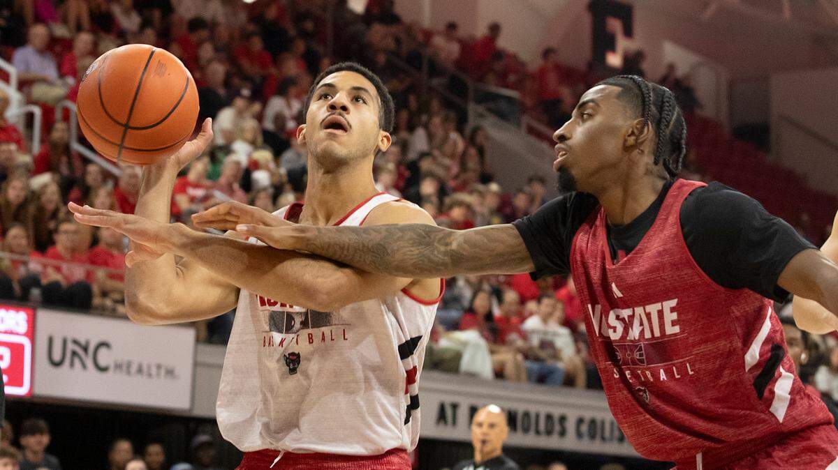 N.C. State’s Ismael Diouf is fouled by teammate Dontrez Styles during a scrimmage at the Primetime with the Pack preseason event on Friday, Oct. 25, 2024, at Reynolds Coliseum in Raleigh, N.C.