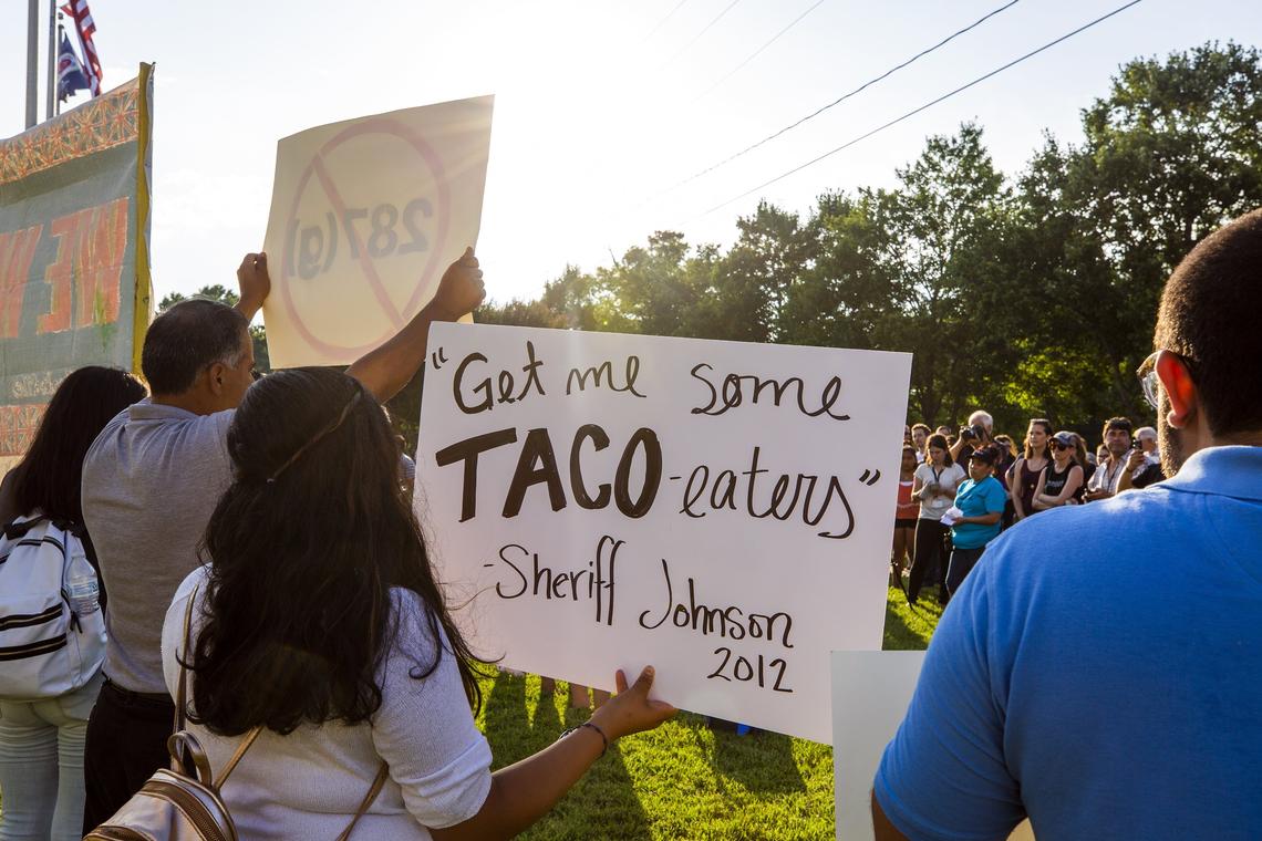 Protestors mocked a quote by Alamance County Sheriff Terry Johnson, where he referred to Latinos as "taco-eaters" when directing his deputies to arrest motorists who appeared Latino, during a protest opposing the return of an ICE program known as 287g, that allows sheriff deputies to act as immigration agents, outside the Alamance County Superior Court on Wednesday, Jun. 13, 2018, in Graham, NC. Johnson has re-applied for the program even after his department was investigated by the Department of Justice in 2012 for racial profiling against Latinos under the program.
