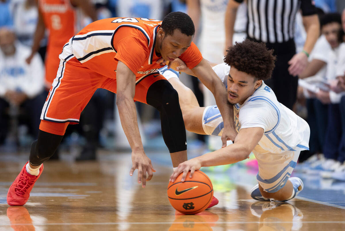 North Carolina’s Seth Trimble (7) forces a turnover by Syracuse’s Quadir Copeland (24) in the first half on Saturday, January 13, 204 at the Smith Center in Chapel Hill, N.C.