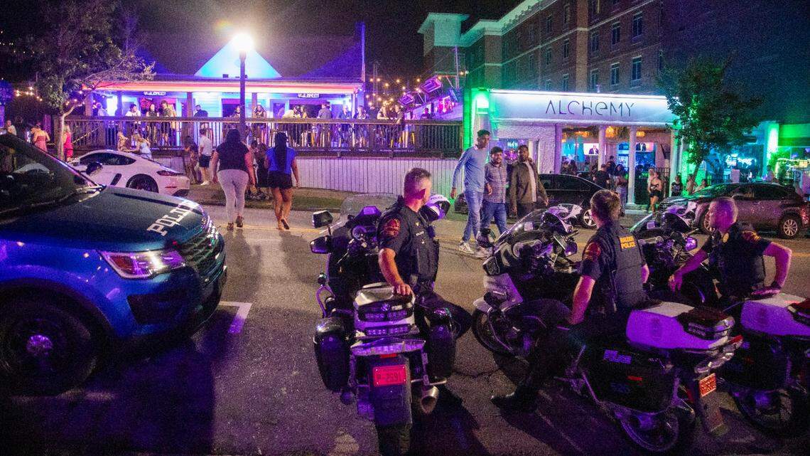 Raleigh Police officers maintain a presence at midnight in the Glenwood South district on Friday, July 21, 2023.