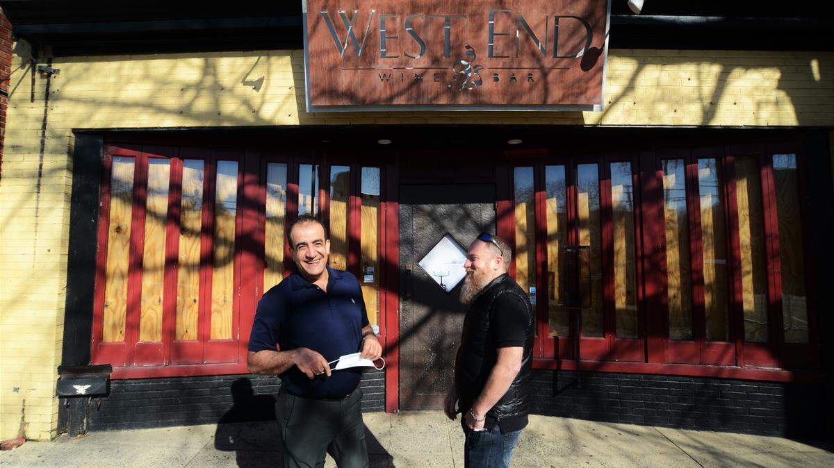 Chapel Hill’s West End Wine Bar is being sold to Mediterranean Deli owner Jamil Kadoura, left, who plans to open an events space. West End owner Jared Resnick, right, will continue operating the wine bar’s location in Durham.