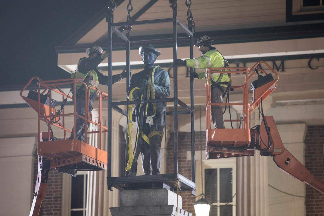 Workers prepare the Confederate monument outside the Chatham County courthouse for removal early Wednesday morning, Nov. 20, 2019.