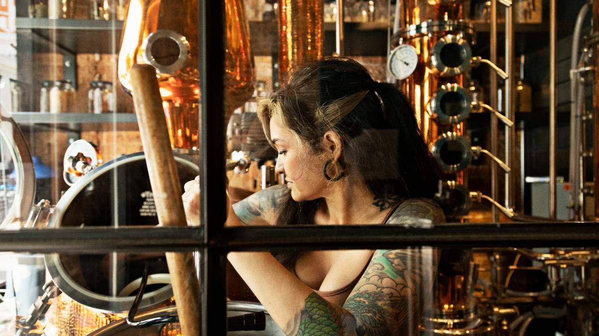 Distiller Mena Killough works on a batch of agave spirits at Young Hearts Distilling Company in downtown Raleigh on Wednesday, Aug. 12, 2021, in advance of officially opening. Young Hearts will combine a bar and food program run the former Busy Bee space.
