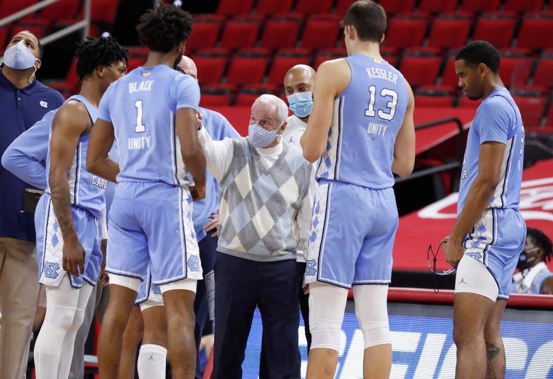 North Carolina head coach Roy Williams talks with his team during a break in play during the second half of N.C. State’s 79-76 victory over UNC at PNC Arena in Raleigh, N.C., Tuesday, December 22, 2020.