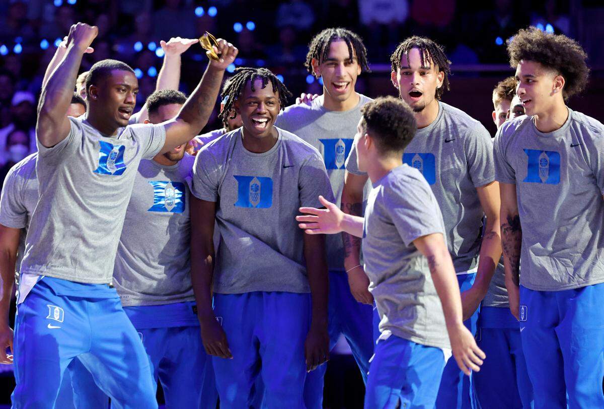 From left, Duke’s Dariq Whitehead, Mark Mitchell, Christian Reeves, Dereck Lively II and Tyrese Proctor cheer on Spencer Hubbard as he is introduced during Duke’s Countdown to Craziness at Cameron Indoor Stadium in Durham, N.C., Friday, Oct. 21, 2022.