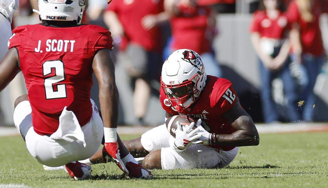 N.C. State defensive back Devan Boykin (12) intercepts the ball during the first half of N.C. State’s game against Clemson at Carter-Finley Stadium in Raleigh, N.C., Saturday, Oct. 28, 2023.