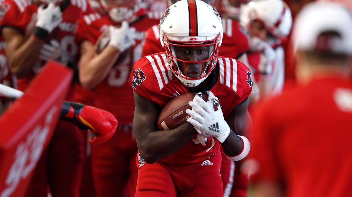 N.C. State wide receiver Emeka Emezie (86) keeps hold of the ball during practice in Raleigh, N.C., Friday, March 6, 2020.