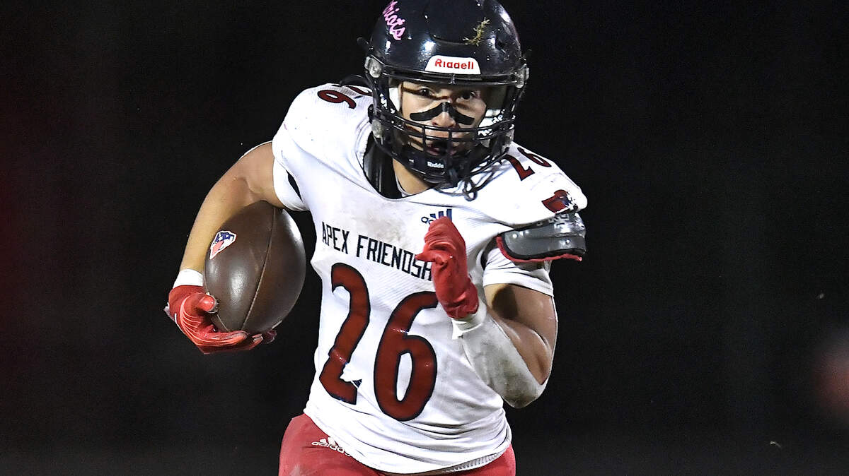 Apex Friendship running back Jaden Avery (26) runs for yardage against Middle Creek during the first half. The Middle Creek Mustangs and the Apex Friendship Patriots met in a football game in Cary, N.C. on October 25, 2024.