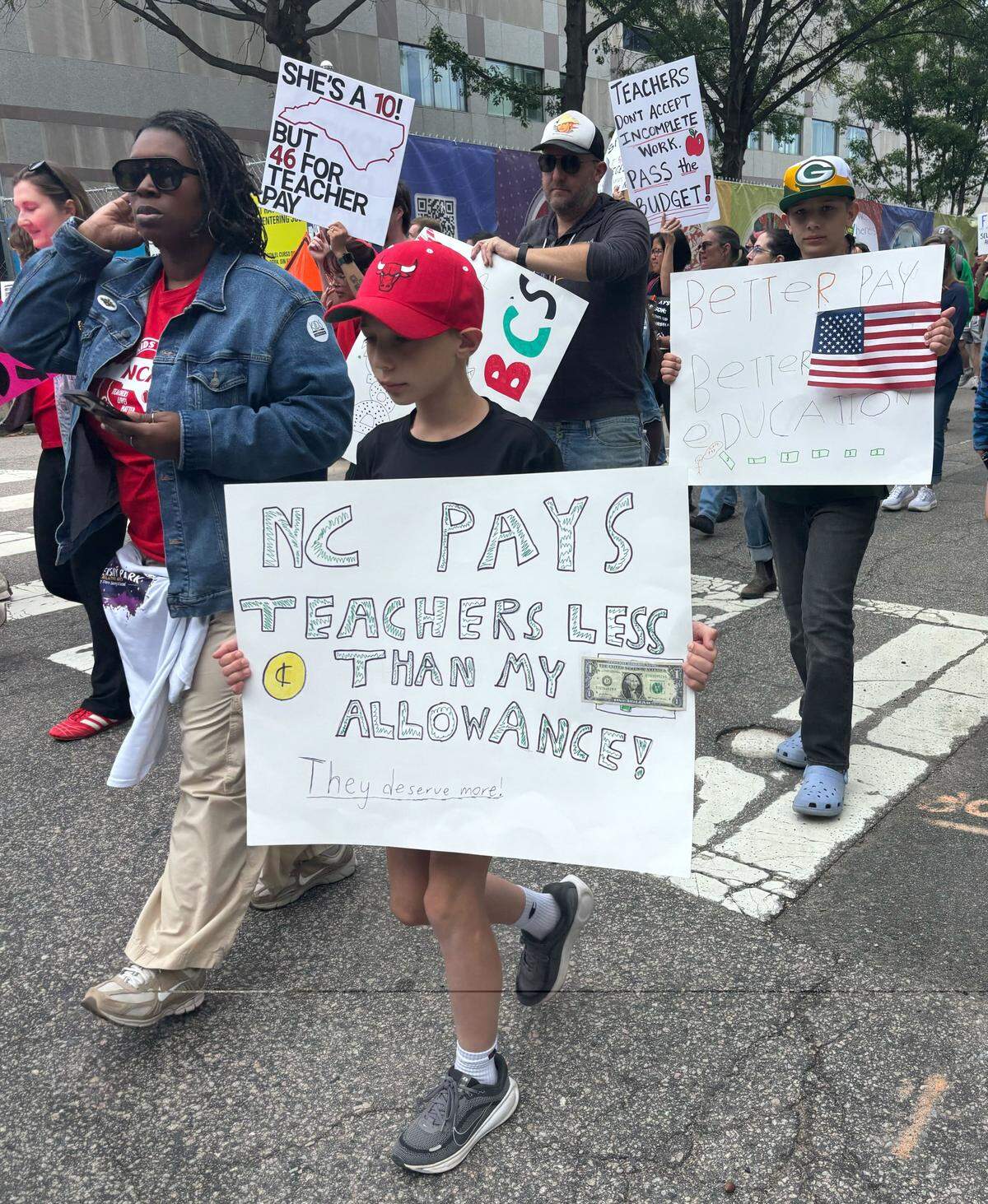 Teachers and supporters march through downtown Raleigh, May 1, 2026.