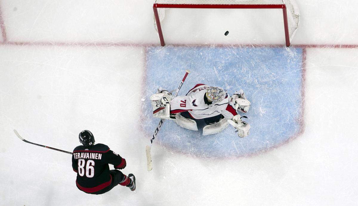 Carolina Hurricanes’ Teuvo Teravainen (86) scores the game winning goal on Washington Capitals’ goalie Braden Holtby (70) during the second period in game four of the first round Stanley Cup series game on Thursday, April 18, 2019 at the PNC Arena in Raleigh, N.C. The Hurricanes defeated the Capitals 2-1.