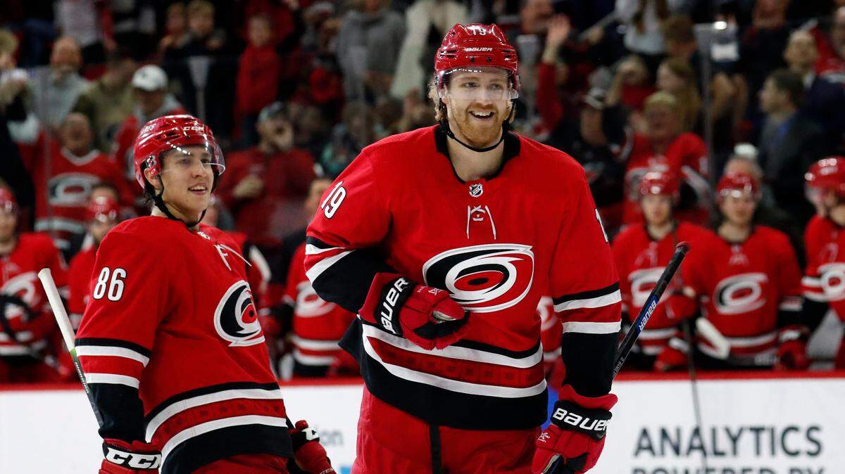 Carolina Hurricanes defenseman Dougie Hamilton (19) celebrates one of his two goals in Tuesday’s 6-1 win over the Los Angeles Kings.