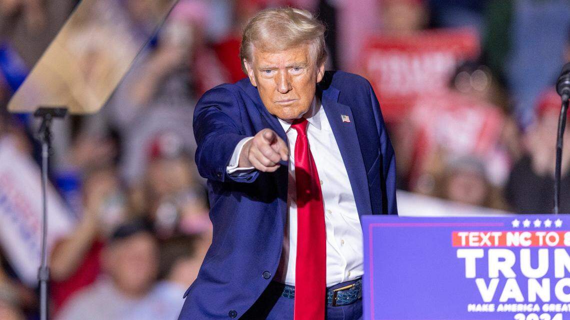 Former President Donald Trump acknowledges the crowd while leaving the stage following a rally speech at Minges Coliseum in Greenville on Monday, Oct. 21, 2024. With two weeks until Election Day, Trump went on a three-city tour, in which Trump will also see the destruction caused by Hurricane Helene in Asheville and speak at a faith conference in Concord.