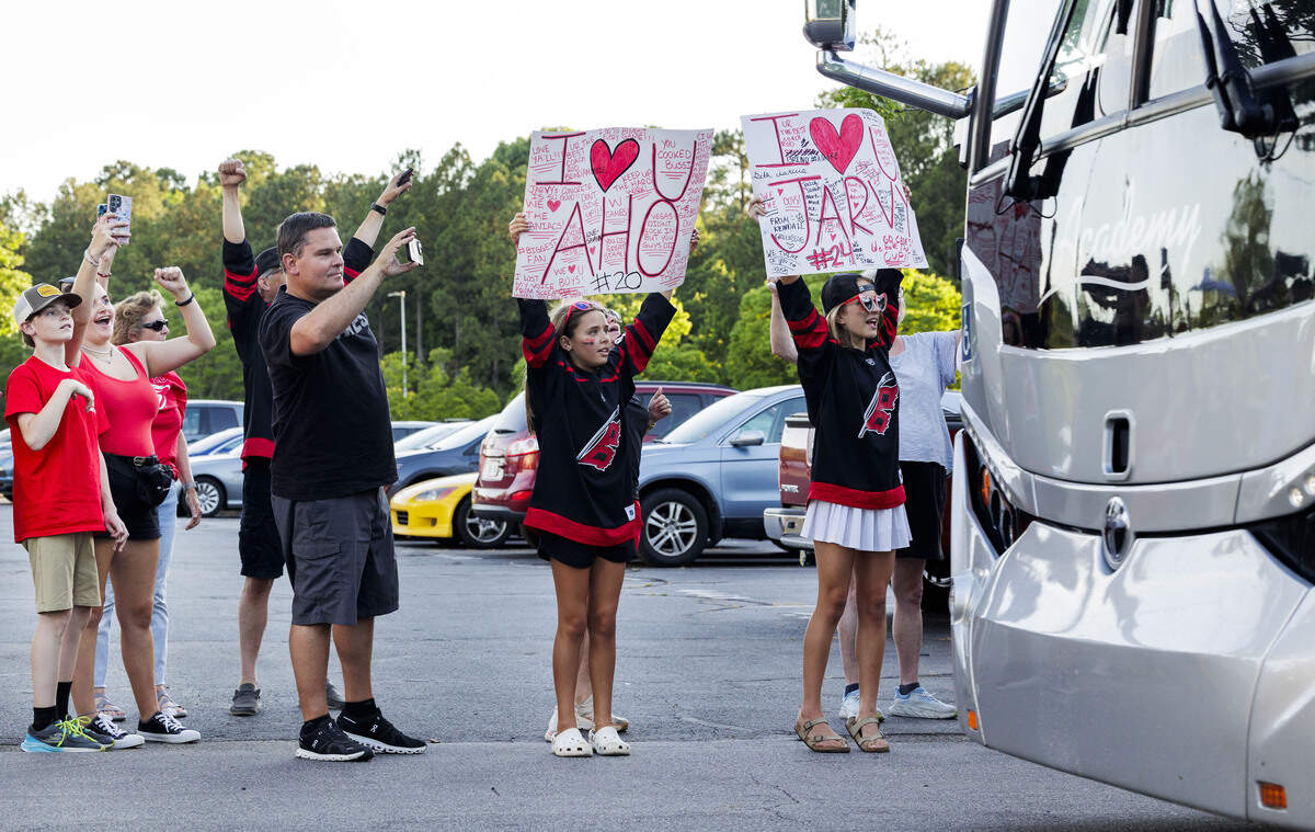Fans waited in the parking lot to greet the families of Carolina Hurricanes players outside Lenovo Center on June 15, 2026, in Raleigh, North Carolina, as they arrived back home following the Stanley Cup finals game 6, which took place in Las Vegas.