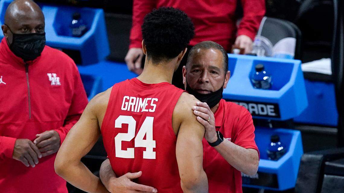 Houston guard Quentin Grimes (24) gets a hug from head coach Kelvin Sampson at the end of Houston’s Final Four loss to Baylor onSaturday, April 3, 2021, at Lucas Oil Stadium in Indianapolis.