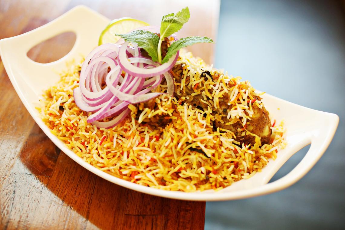 Persis Indian Grill’s Chicken Biryani is buried beneath an avalanche of spice-fragrant, lemon-tinged basmati rice.