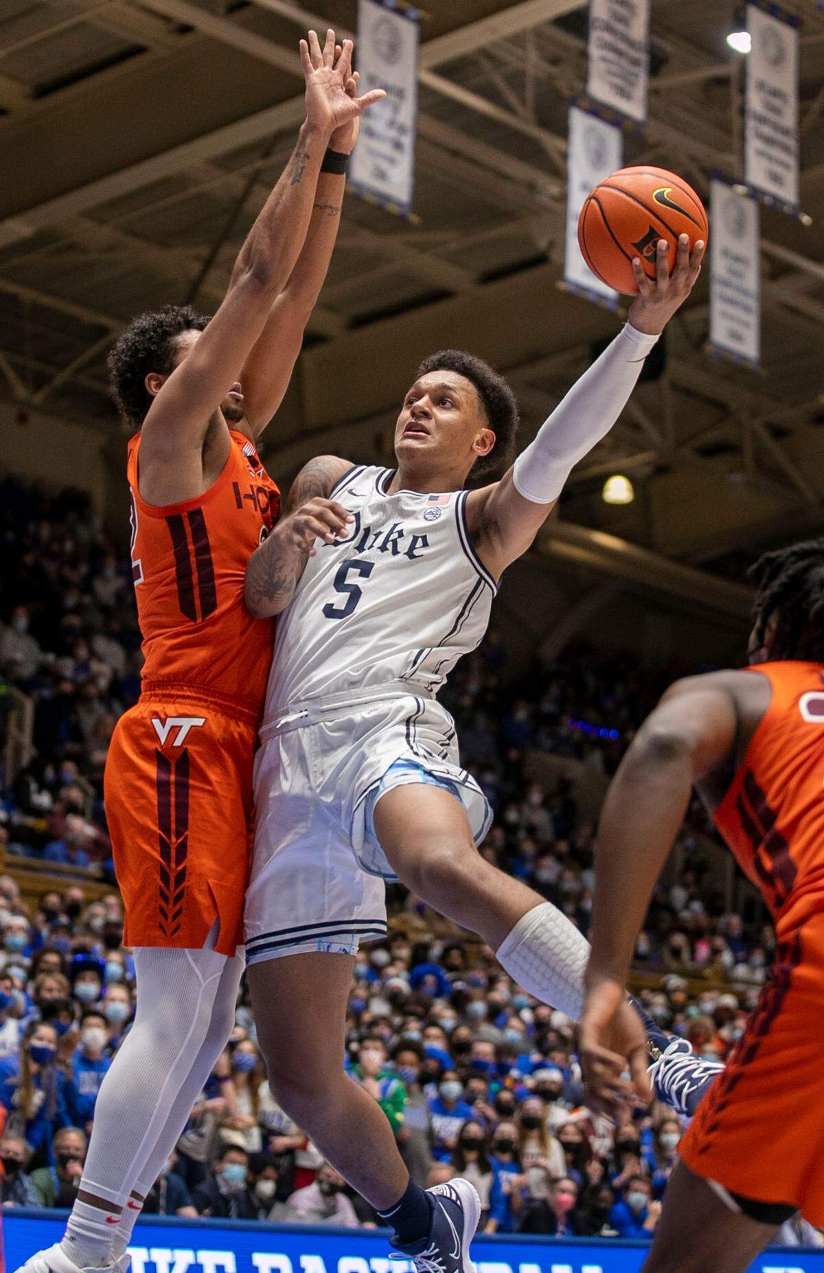 Duke’s Paolo Banchero (5) drives to the basket against Virginia Tech’s Keve Aluma (22) during the second half on Wednesday, December 22, 2021 at Cameron Indoor Stadium in Durham, N.C. Banchero lead all scores with 23 points and the Blue Devils to a 76-65 victory.