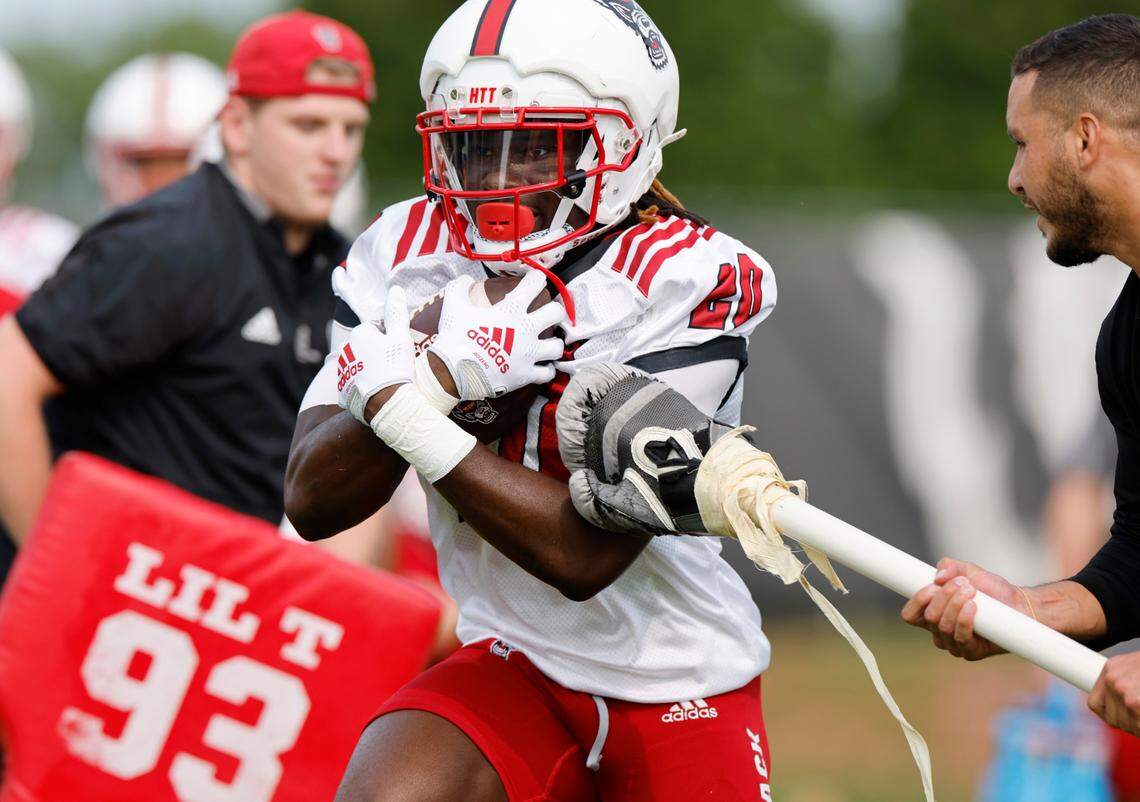 N.C. State running back Kendrick Raphael (20) runs a drill during the Wolfpack’s first fall practice in Raleigh, N.C., Wednesday, August 2, 2023.