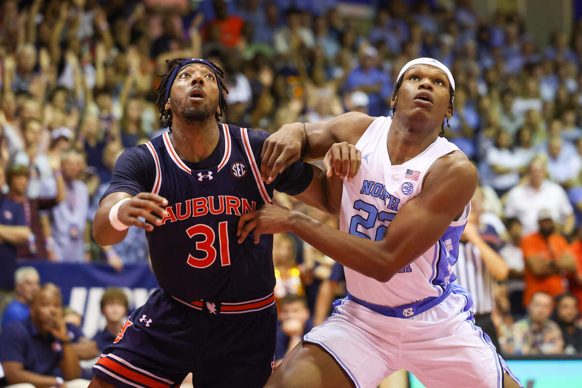 Chaney Johnson, left, of the Auburn Tigers and Ven-Allen Lubin of the North Carolina Tar Heels battle for position during a free throw attempt during the second half of the Maui Invitational at the Lahaina Civic Center on Nov. 26, 2024 in Lahaina, Hawaii. Lubin will return to Maui this year with N.C. State.