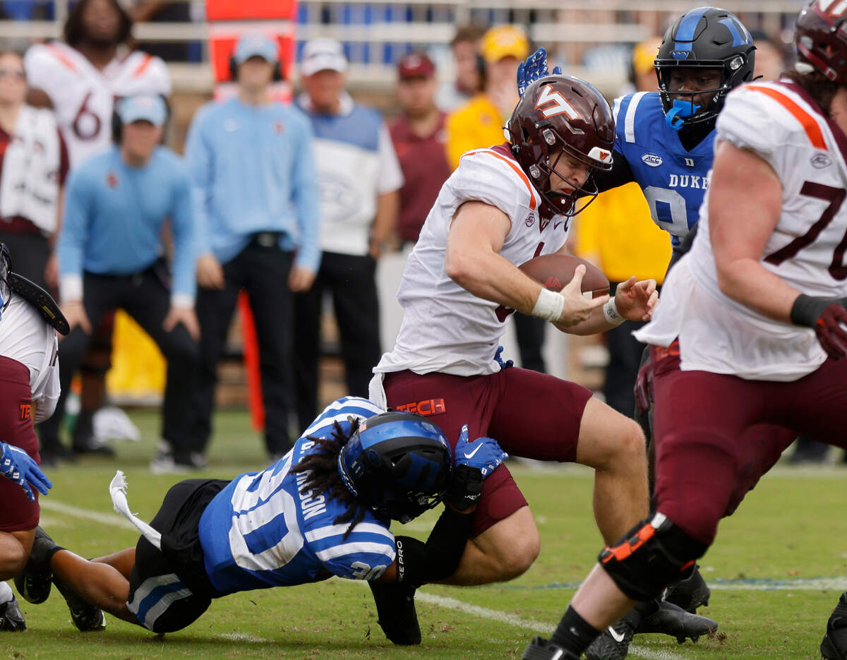 Duke Blue Devils defensive back Brandon Johnson sacks Virginia Tech Hokies quarterback Grant Wells during the second half of a football game at Wallace Wade Stadium on Saturday, Nov. 12, 2022, in Durham, N.C.