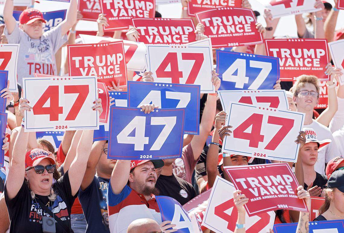 People cheer as U.S. Rep. Dan Bishop, Republican candidate for N.C. attorney general, speaks during a rally in support of former President and current Republican candidate for president Donald Trump in Wilmington, N.C. on Saturday, Sept. 21, 2024.