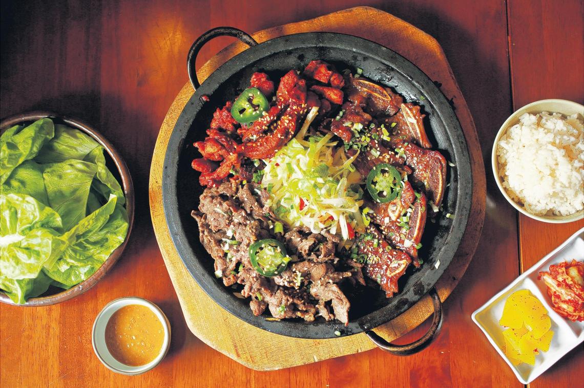 Ssam, a culinary mashup of Korean barbecue and lettuce wraps, is nearly as much fun to assemble as it is to eat at Aroma Korea. Served with a side of rice and a small dish of seasoned soybean paste, ssam is offered with your choice of four meats: bulgogi, galbi, dak galbi or samgyupsal. Better still, round up a friend or two and spring for the BBQ set, pictured here, which gets you any three of the four.