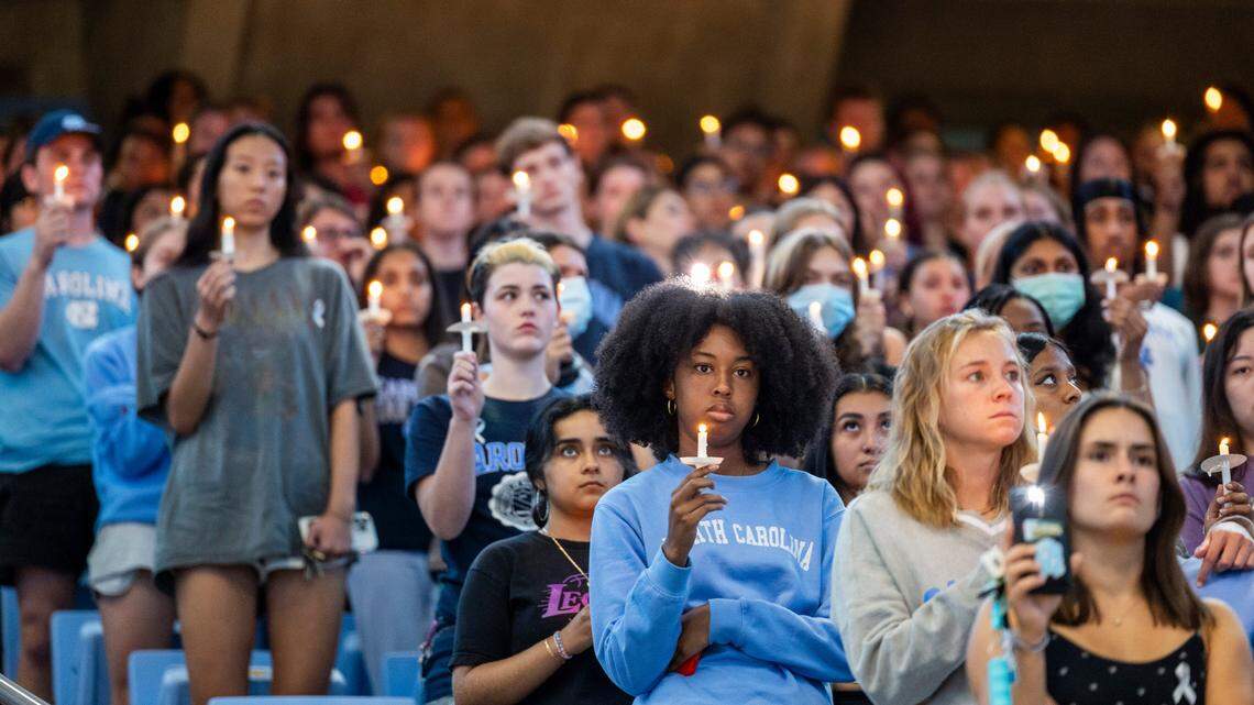 UNC-Chapel Hill students, faculty and family hold a candlelight vigil Friday, Aug 30, 2023 at the Dean Smith Center in honor of professor Zijie Yan who was shot and killed on campus on Monday.
