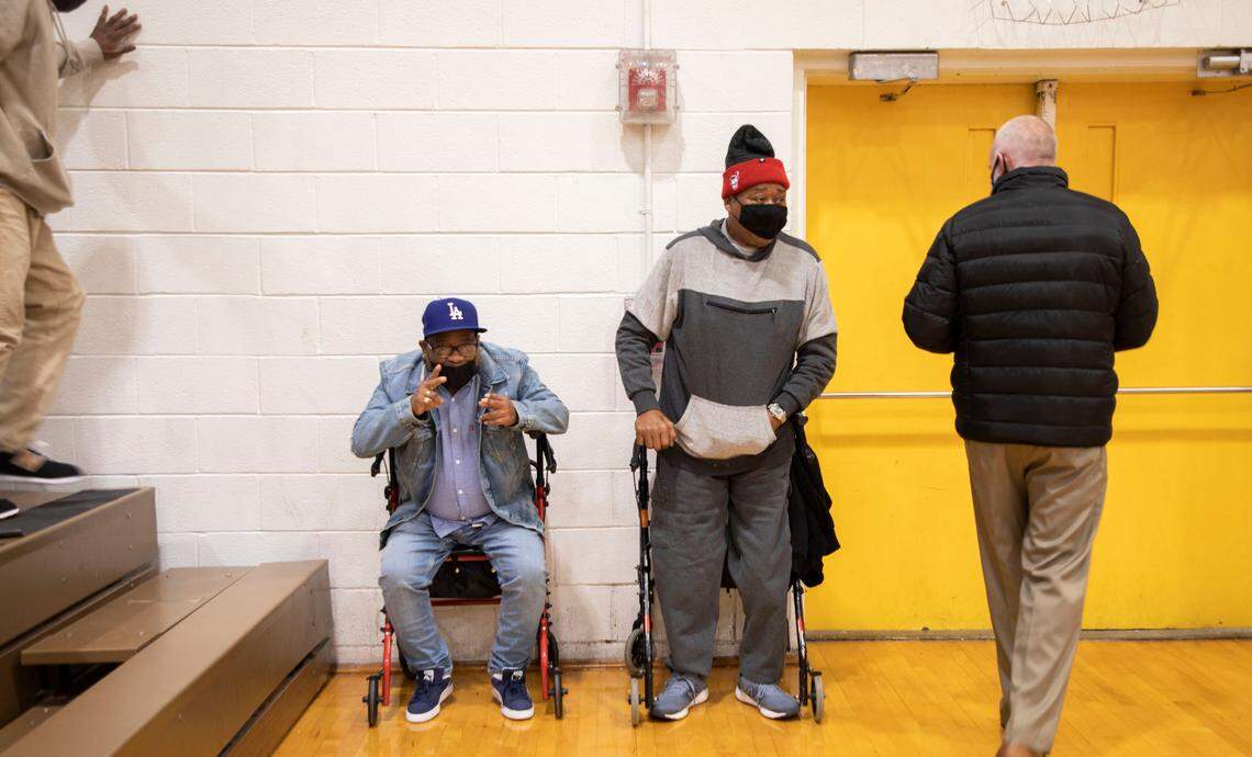 Skeet Davis, middle right, prepares to leave the Kinston High School gym after a home game in Kinston, N.C. on Jan. 11, 2022.