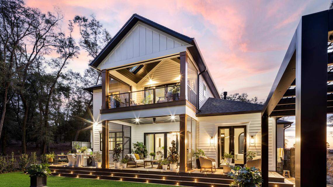 The two-story home has a pool and other outdoor areas.