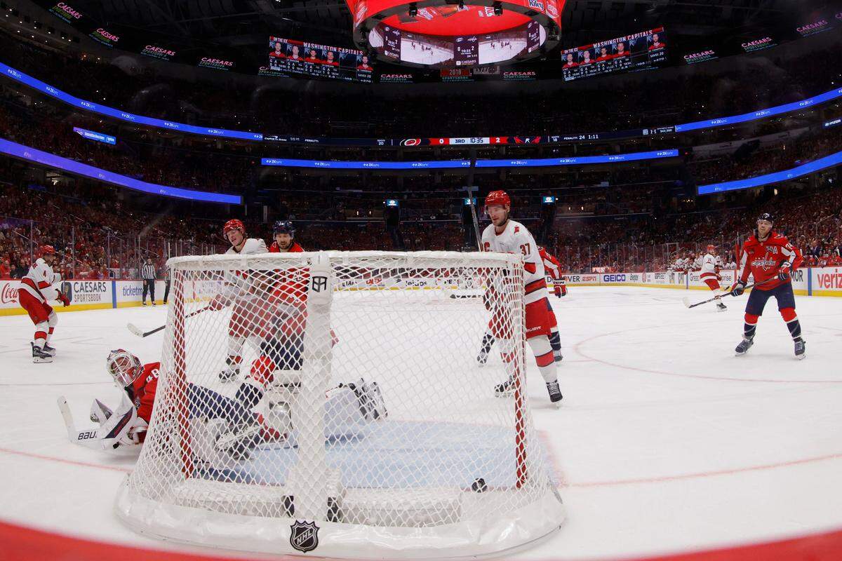 Carolina Hurricanes defenseman Shayne Gostisbehere (4) scores a goal on Washington Capitals goaltender Logan Thompson (48) in the third period in Game 2 of the second round of the 2025 Stanley Cup Playoffs at Capital One Arena on Thursday.