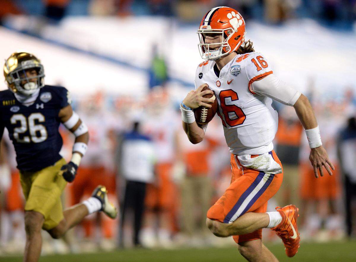 Clemson Tigers quarterback Trevor Lawrence rushes for a touchdown during third quarter action of the ACC Championship game. Clemson defeated Notre Dame 34-10 to win the championship at Bank of America Stadium in Charlotte, NC on Saturday, December 19, 2020.  