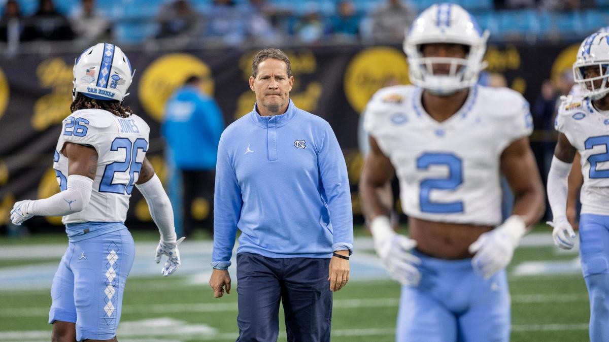 North Carolina assistant head coach for defense, Gene Chizik, walks among the players prior to their game against West Virginia in the Duke’s Mayo Bowl on Wednesday, December 27, 2023 at Bank of American Stadium in Charlotte, N.C.