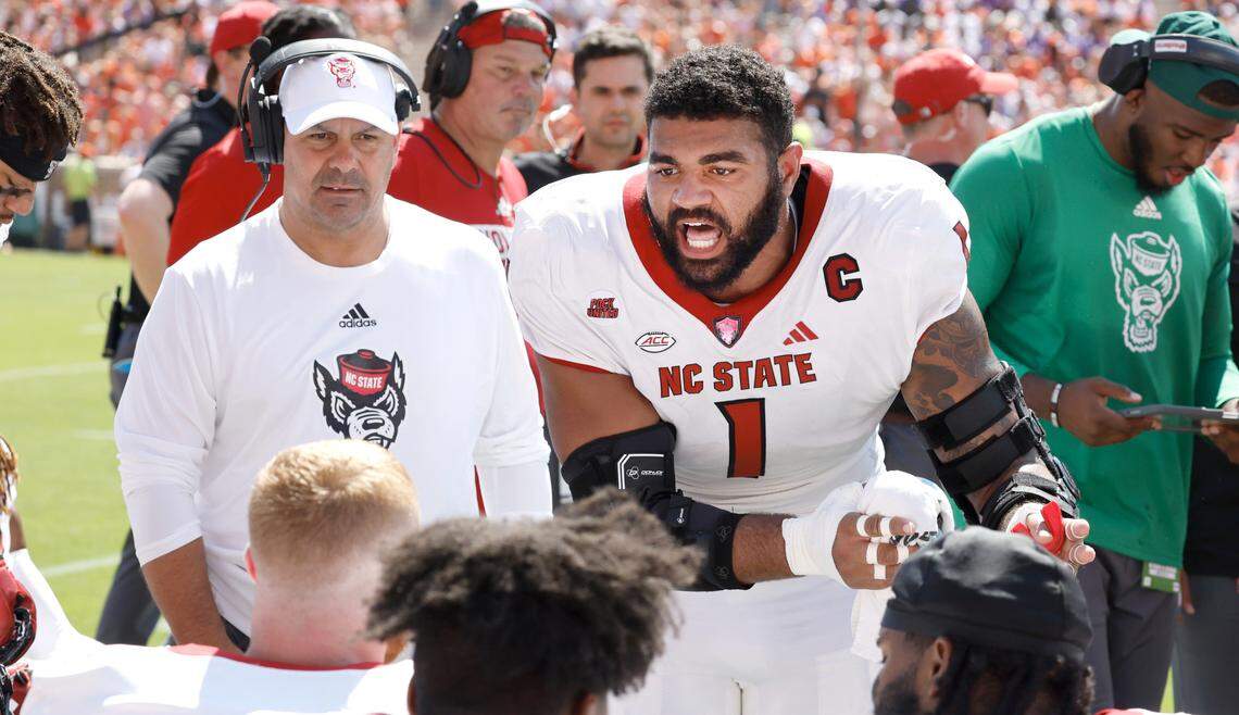 N.C. State defensive end Davin Vann (1) pumps up the defense during the first half of N.C. State’s game against Clemson at Memorial Stadium in Clemson, S.C., Saturday, Sept. 21, 2024.