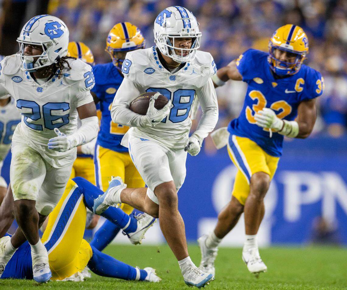 North Carolina’s Alijah Huzzie (28) returns a punt 52-yards for a touchdown in the second quarter to give the Tar Heels a 21-14 lead over Pitt in the second quarter on Saturday, September 23, 2023 at Acrisure Stadium in Pittsburgh, Pa.