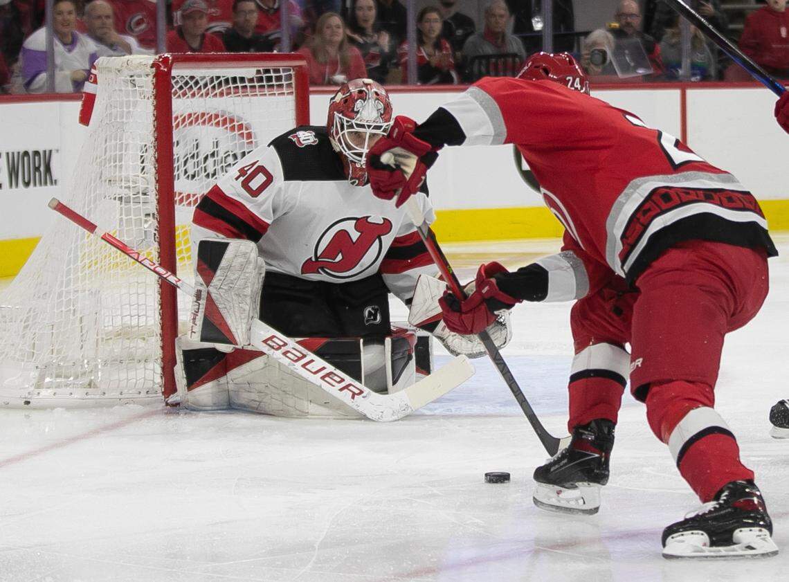 The Carolina Hurricanes Seth Jarvis (24) lines up a shot on New Jersey goalie Akira Schmid (40) in the first period during Game 2 of their second round Stanley Cup playoff series on Friday, May 5, 2023 at PNC Arena in Raleigh, N.C.