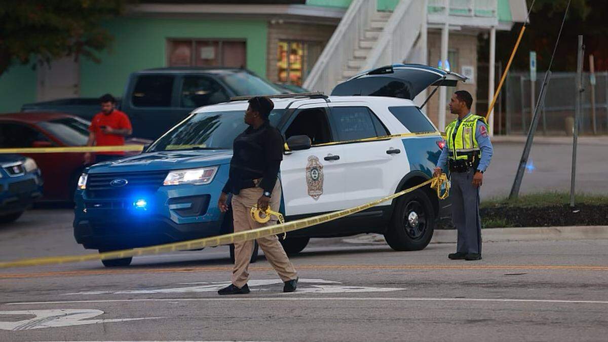 Law enforcement officers block off Old Milburnie Road, Thursday evening, Oct. 13, 2022 after an active shooter was reported with multiple injuries in the Hedingham neighborhood.