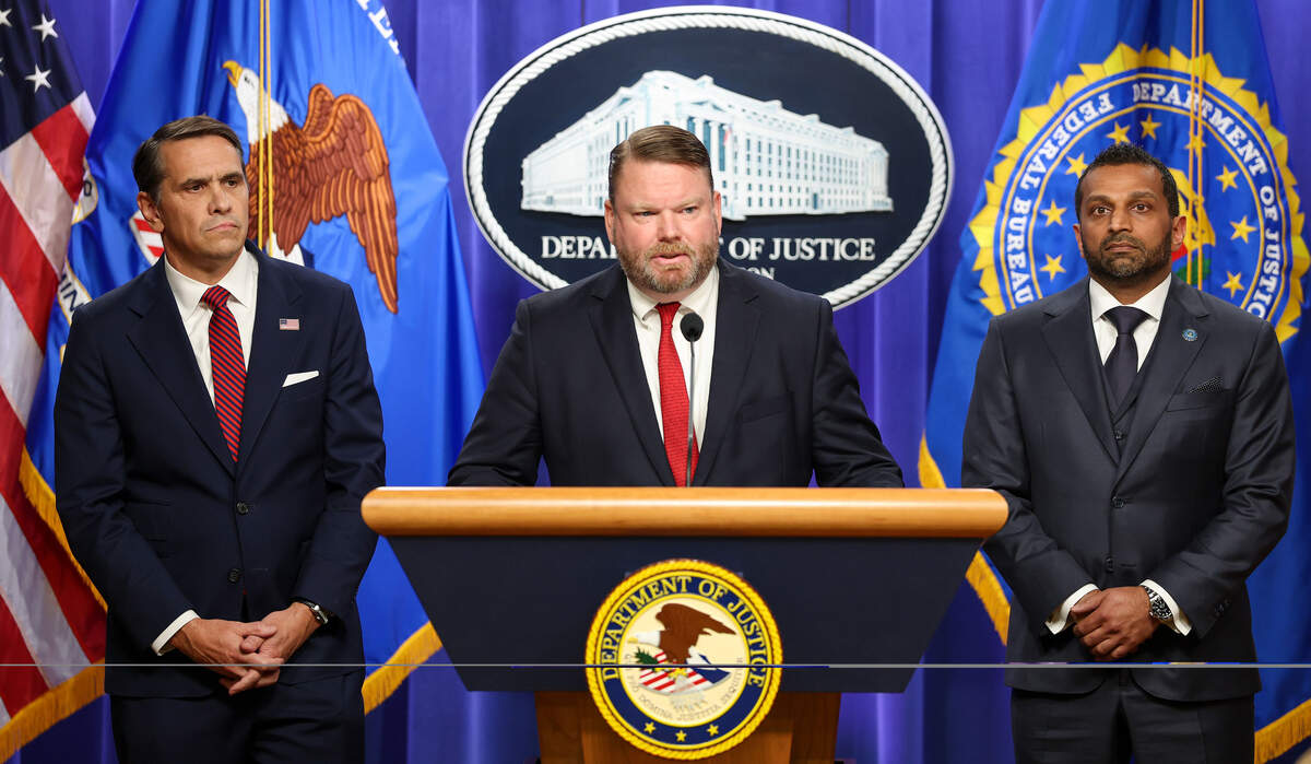 Ellis Boyle, United States Attorney&nbsp;for the Eastern District of North Carolina speaks as Acting Attorney General Todd Blanche (left) and FBI Director Kash Patel listen at a press conference on April 28, 2026 at the Department of Justice in Washington, DC. Charges were brought against former FBI Director James Comey on Tuesday in an investigation over a photo of seashells arranged on a beach posted to social media, that officials said constituted a threat against President Donald Trump.