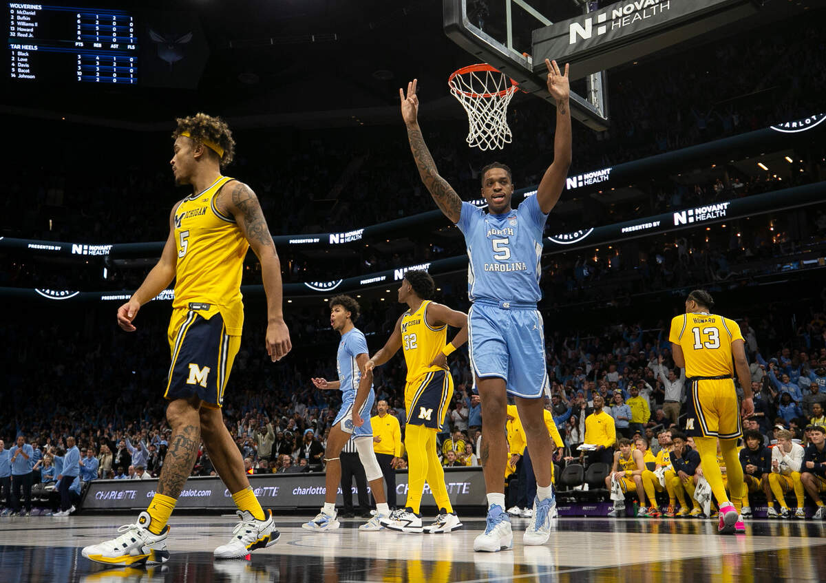 North Carolina’s Armando Bacot (5) reacts after Caleb Love’s basket and foul in the first half on Wednesday, December 21, 2022 at the Spectrum Center in Charlotte, N.C.