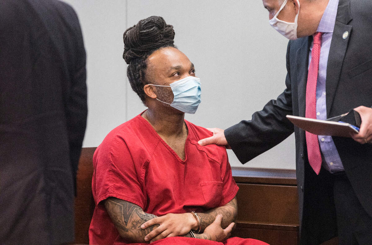 Michael Wayne Goldston, who is one of two men convicted of murder in the 2004 death of Nathan Alston, smiles at attorney Robert Sharpe before the start of a hearing revisiting the case’s outcome at the Durham County Courthouse on Friday, Aug. 20, 2021.