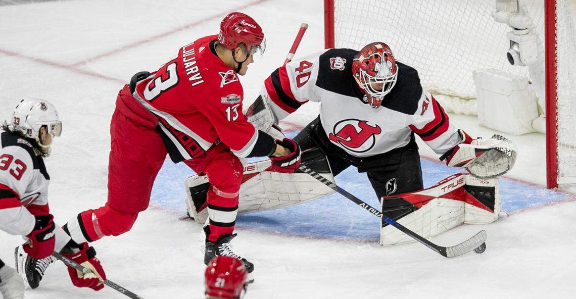 The Carolina Hurricanes Jesse Piljujarvi (13) shoots on New Jersey Devils goalie Akira Schmid (40) in the second period during Game 2 of their second round Stanley Cup playoff series on Friday, May 5, 2023 at PNC Arena in Raleigh, N.C.