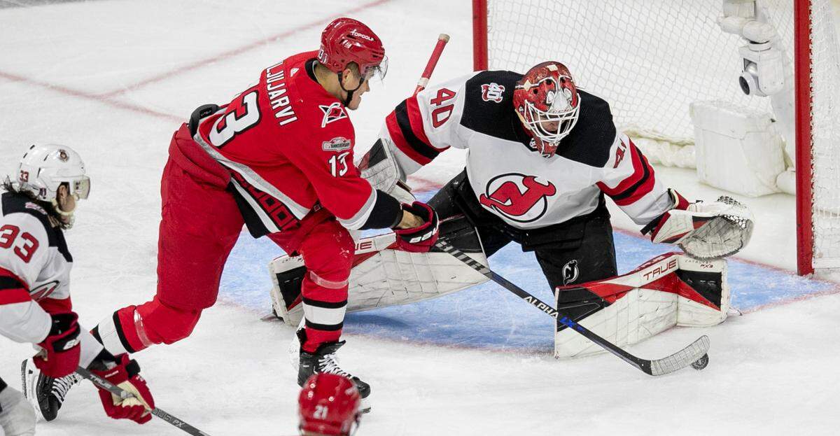 The Carolina Hurricanes Jesse Piljujarvi (13) shoots on New Jersey Devils goalie Akira Schmid (40) in the second period during Game 2 of their second round Stanley Cup playoff series on Friday, May 5, 2023 at PNC Arena in Raleigh, N.C.