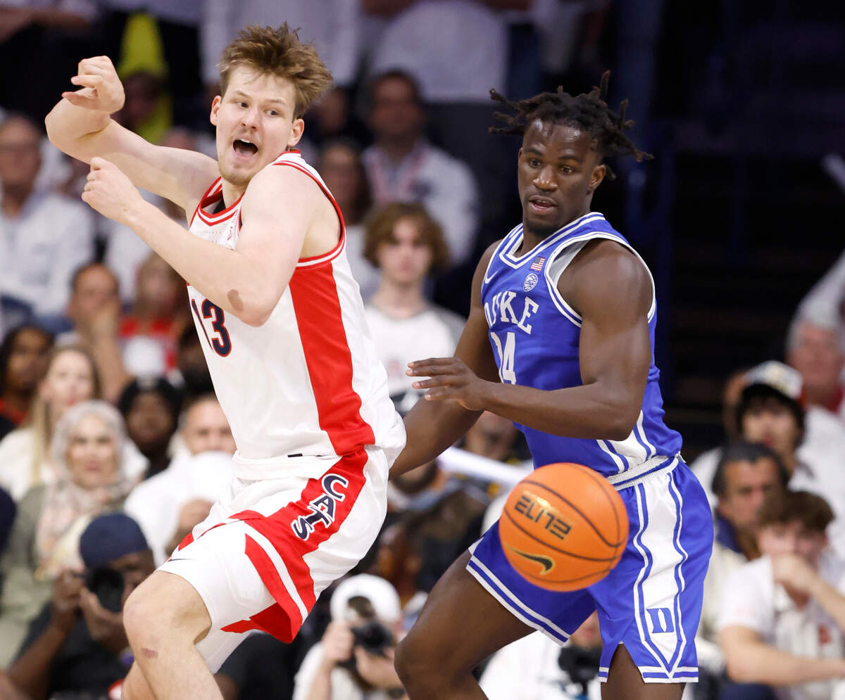 Duke’s Sion James (14) goes after the loose ball after knocking it from Arizona’s Henri Veesaar (13) during the second half of Duke’s 69-55 victory over Arizona at the McKale Memorial Center in Tucson, Ariz., Friday, Nov. 22, 2024.