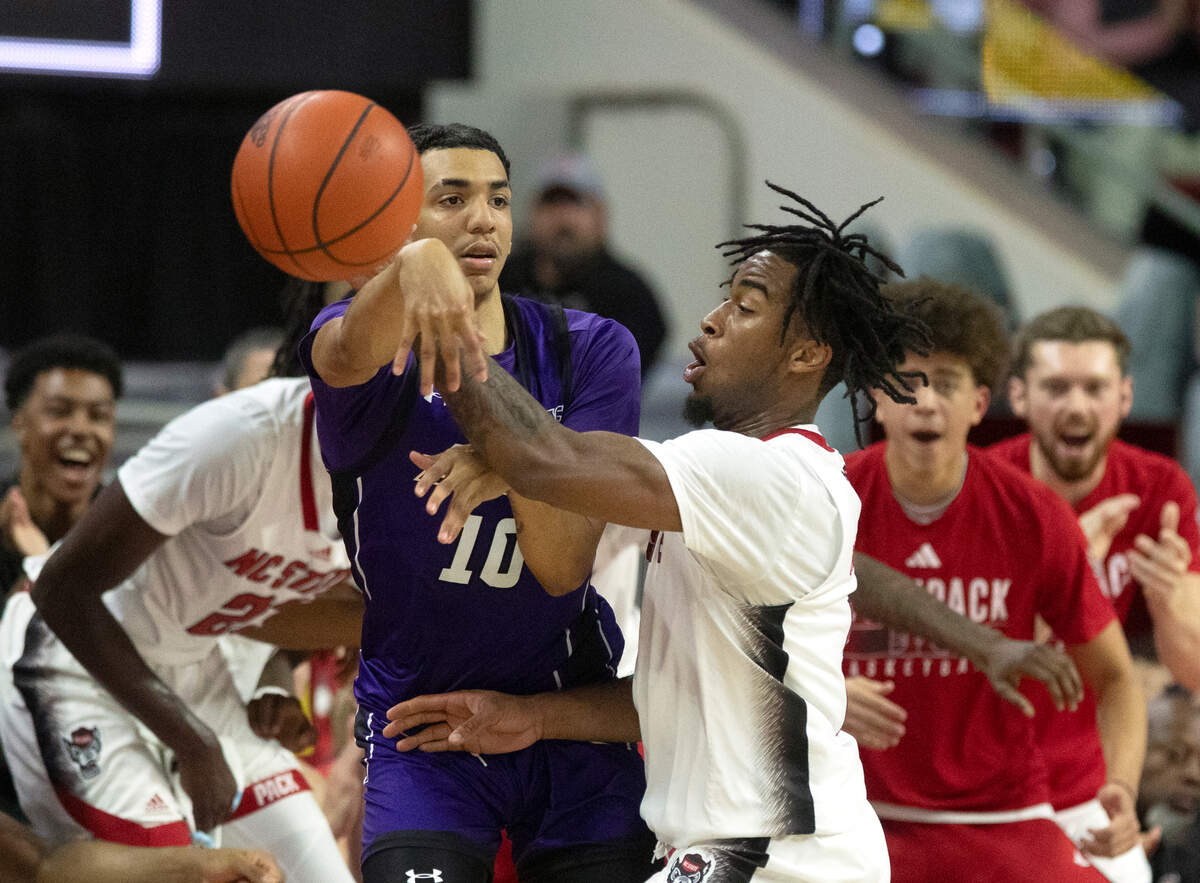 N.C. State’s Jayden Taylor pressures Abilene Christian’s Nasir DeGruy during the first half of the Wolfpack’s game on Friday, Nov. 10, 2023, at PNC Arena in Raleigh, N.C.